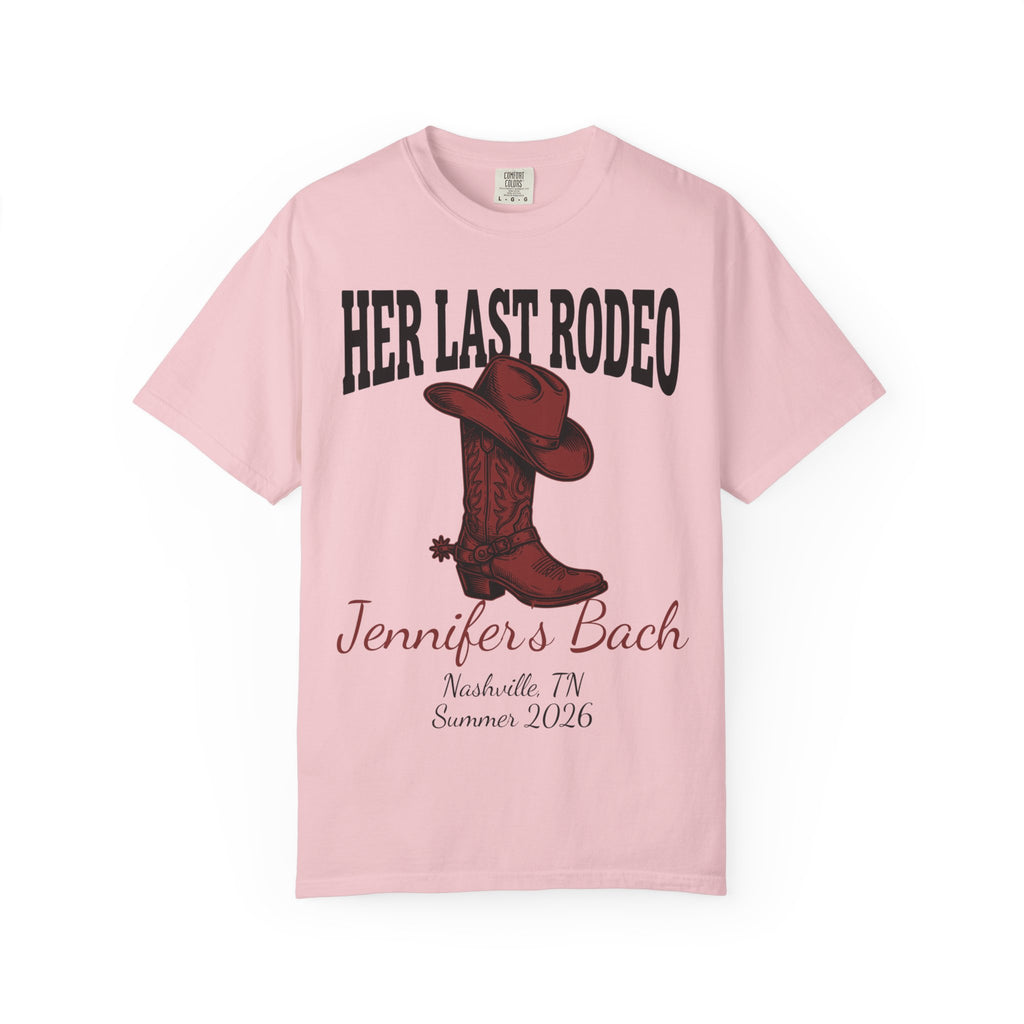 Pink t-shirt with "Her Last Rodeo" text and cowboy boot graphic.
