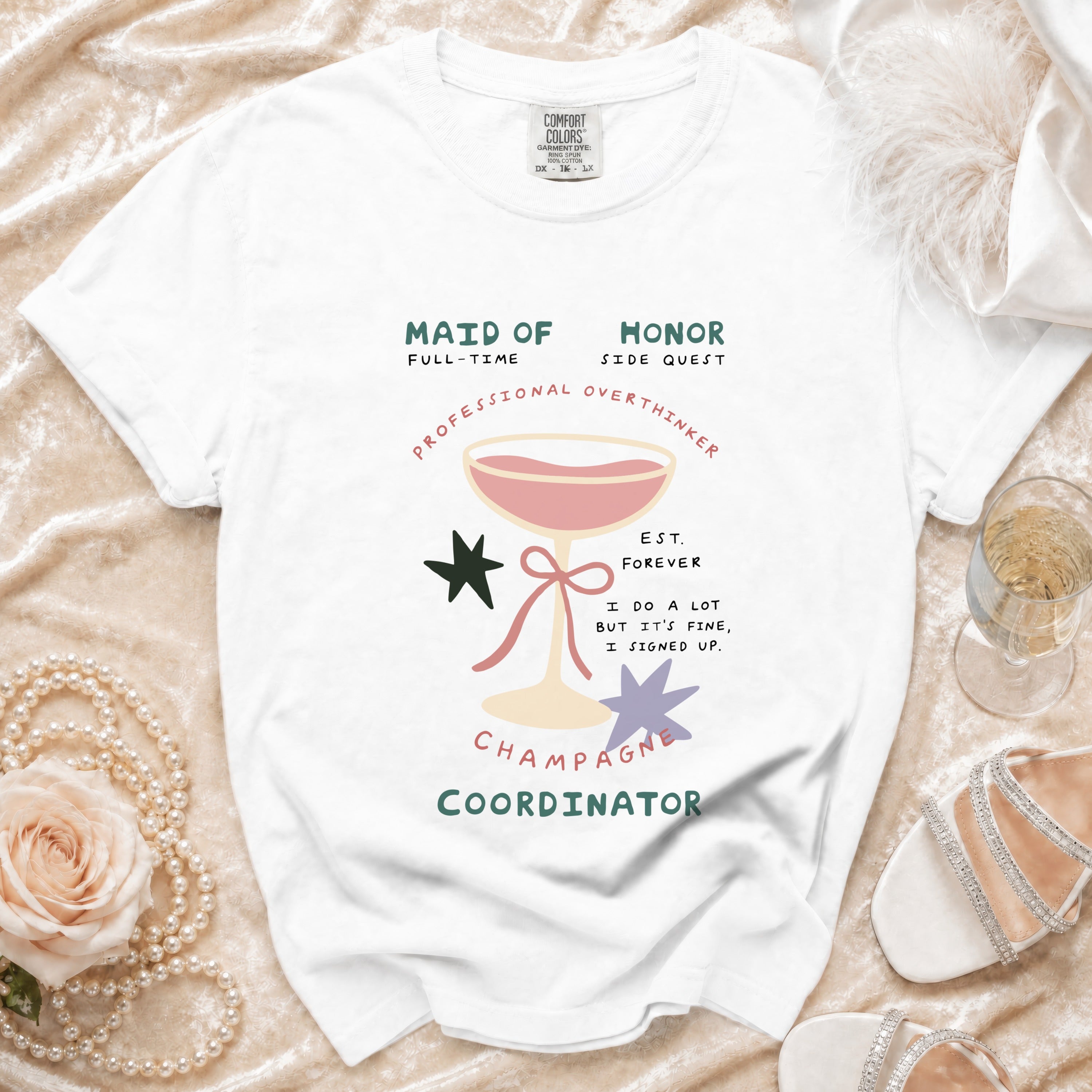 White t-shirt with "Maid of Honor" and "Champagne Coordinator" text.