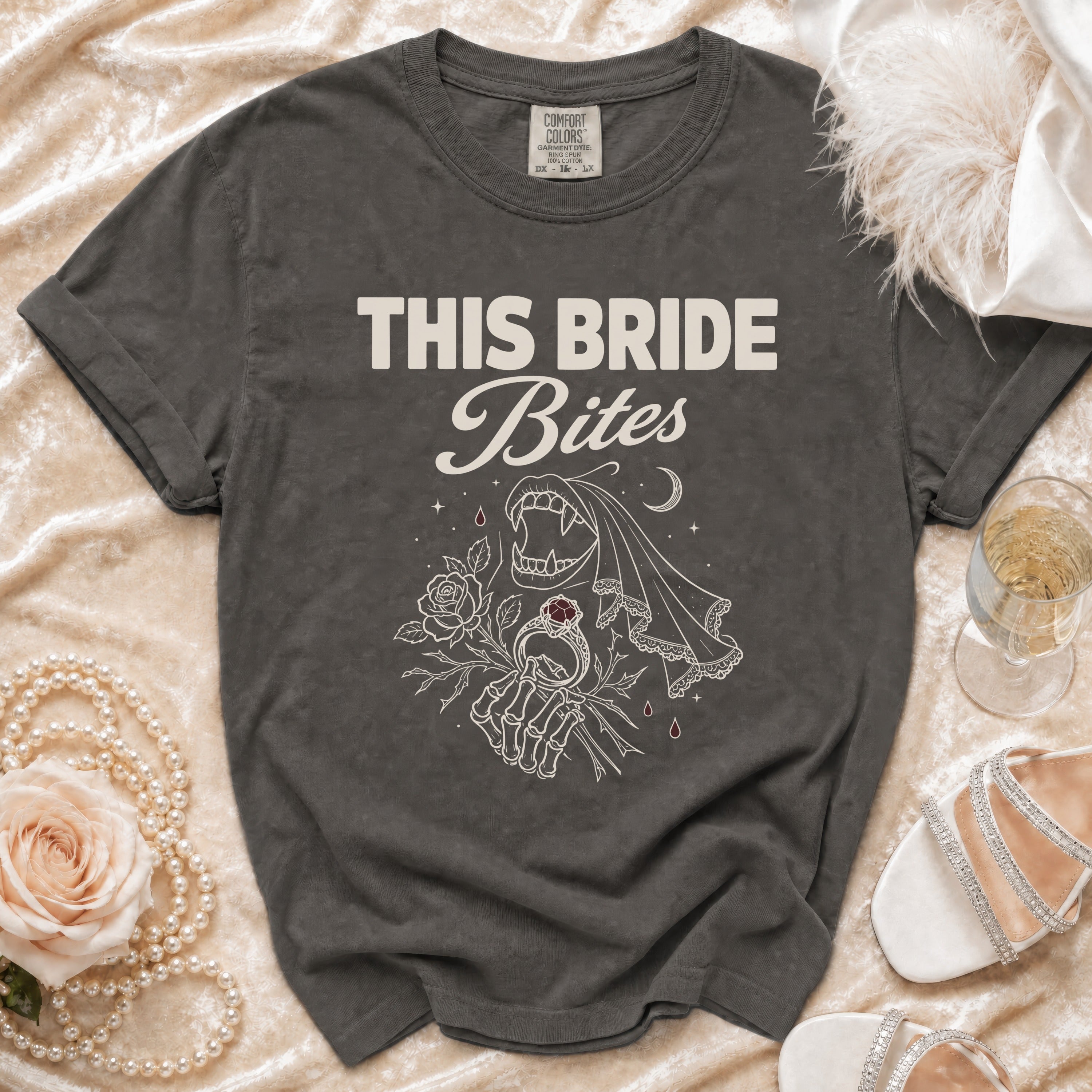 Dark grey t-shirt with "THIS BRIDE Bites" text and vampire bride graphic.