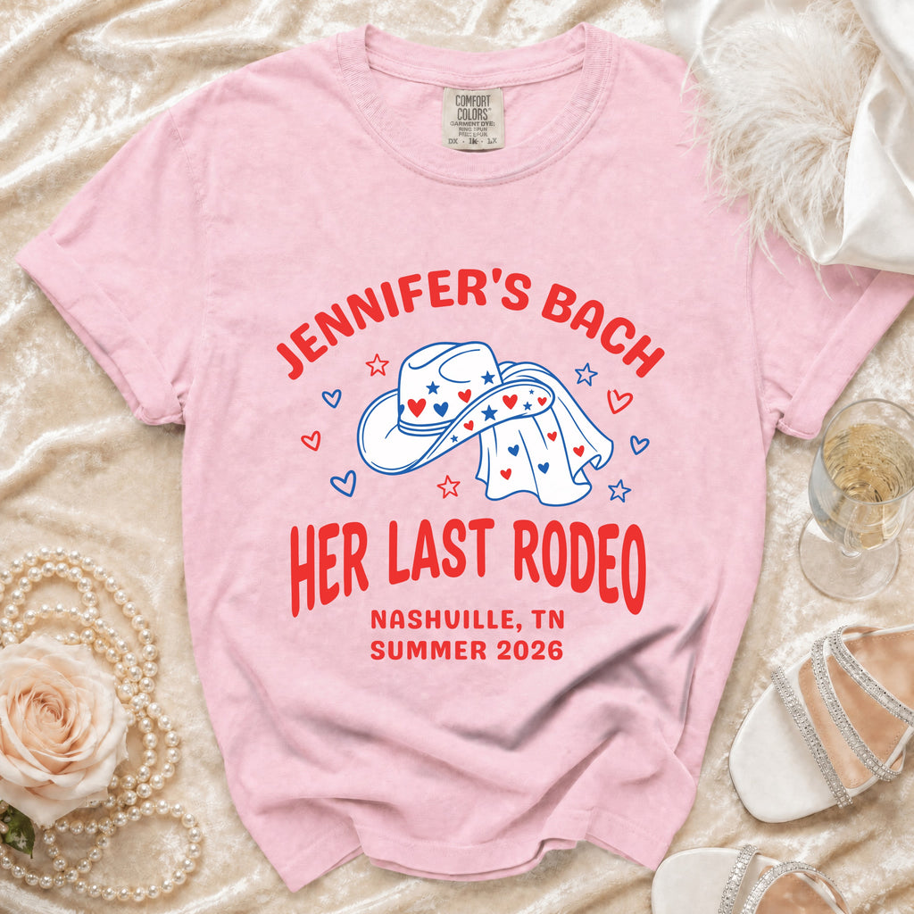 Pink t-shirt with "Jennifer's Bach Her Last Rodeo" text and cowboy hat graphic.