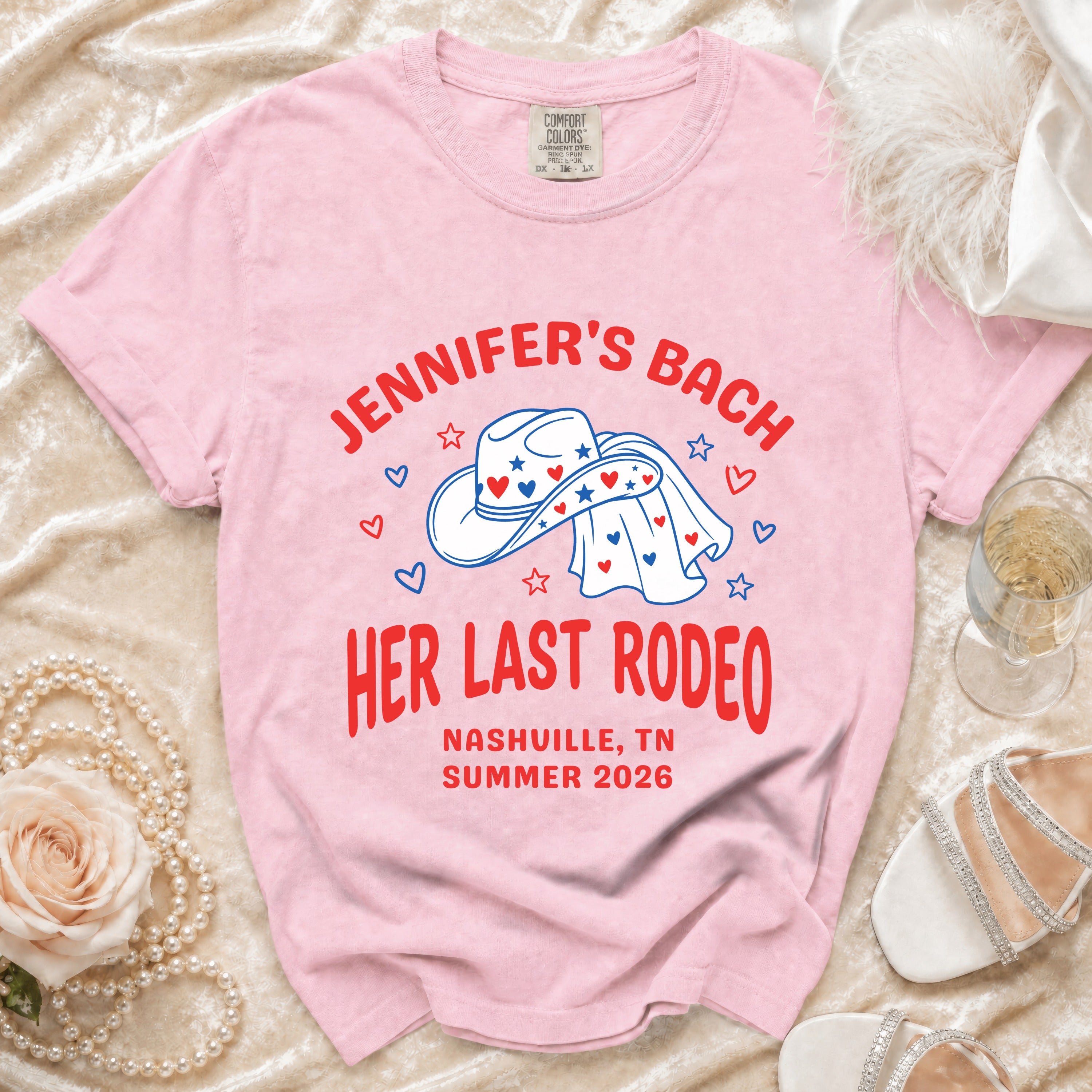 Pink t-shirt with "Jennifer's Bach Her Last Rodeo" text and cowboy hat graphic.