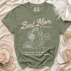Green Comfort Colors t-shirt with "Best Mom by Default" and a ghost bride graphic.
