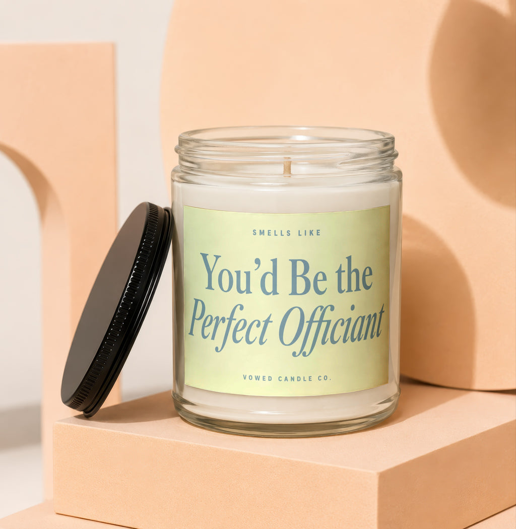 Glass candle with light green label reading "You'd Be the Perfect Officiant."