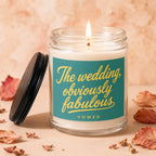 Candle with teal label reading "The wedding, obviously fabulous - VOWED."