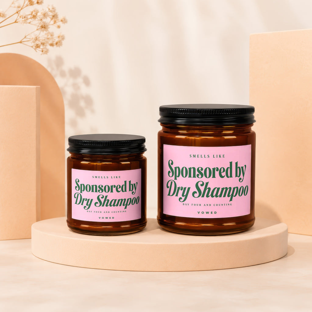 Two amber jars with pink labels reading "Sponsored by Dry Shampoo."