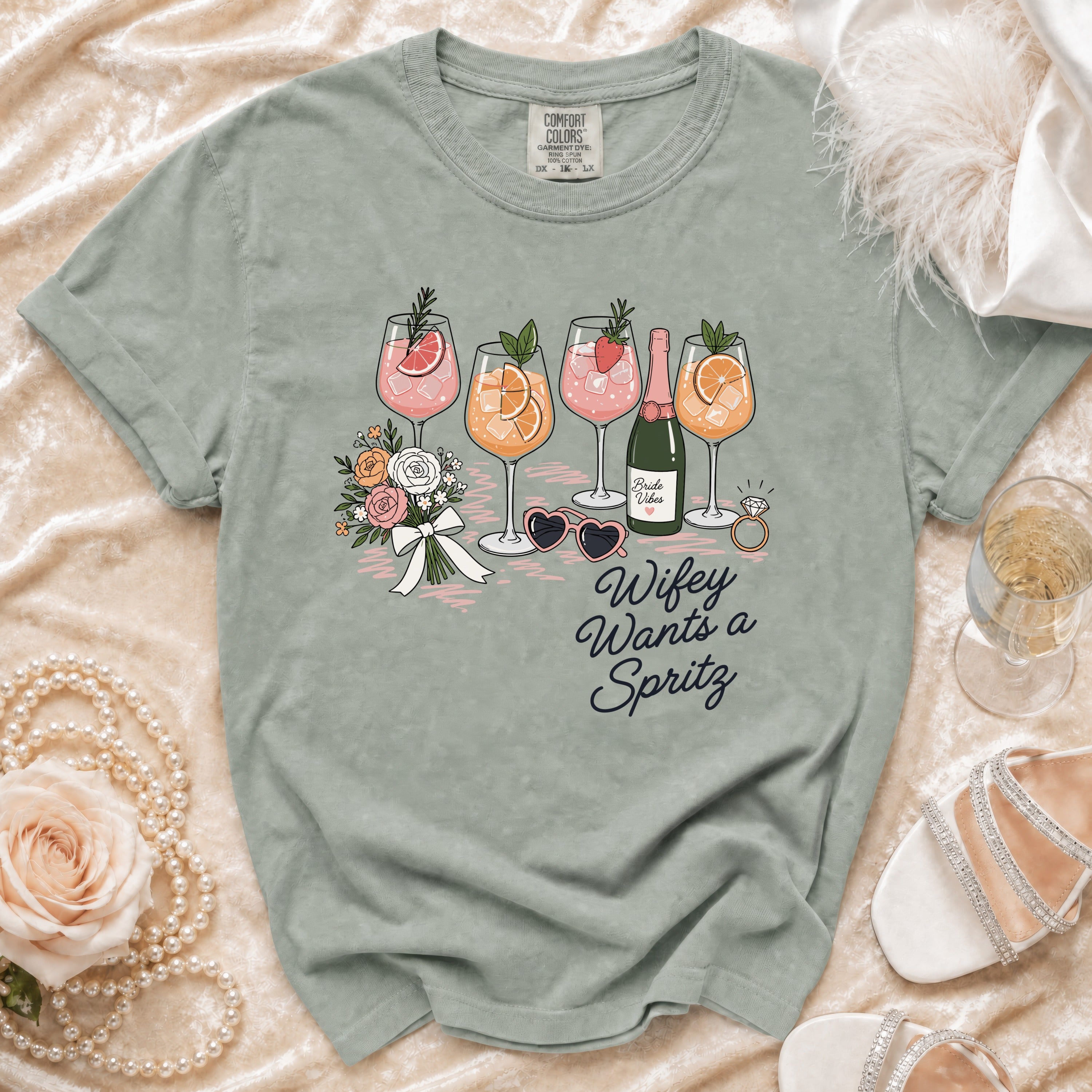 T-shirt with "Wifey Wants a Spritz" graphic and drinks, with wedding accessories.