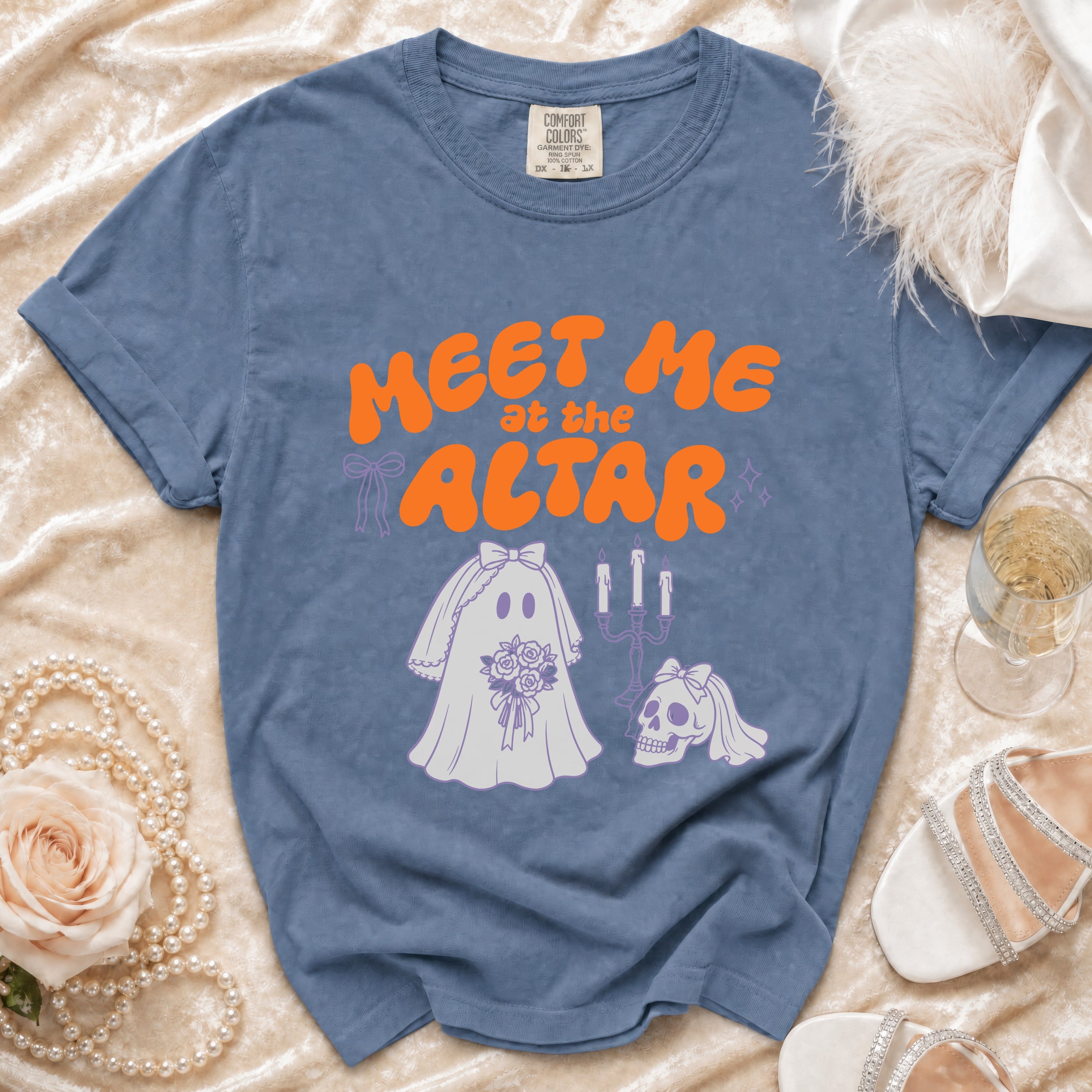 Blue t-shirt with "Meet Me at the Altar" text and ghost bride illustration.