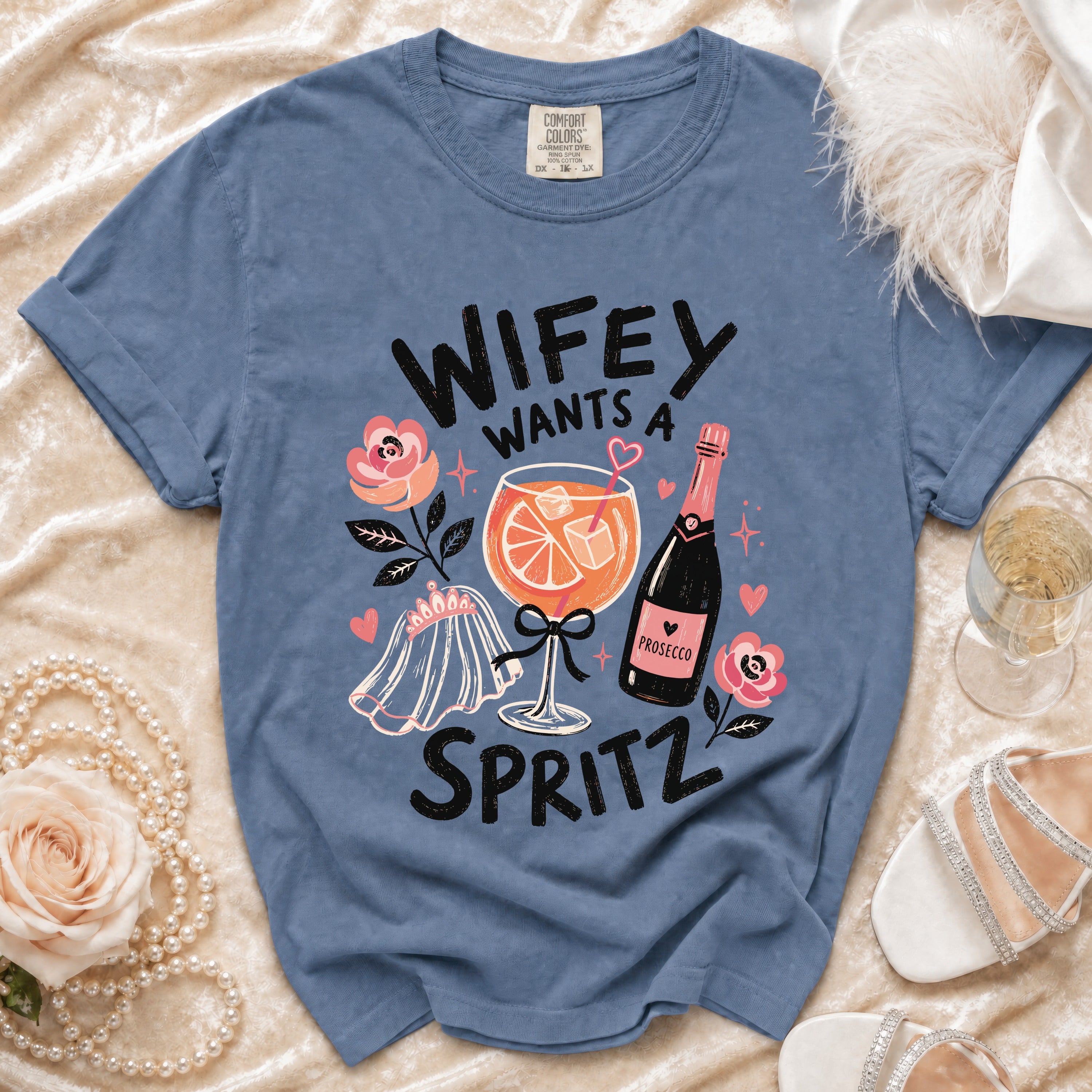 Blue t-shirt with "Wifey Wants a Spritz" text and graphics.