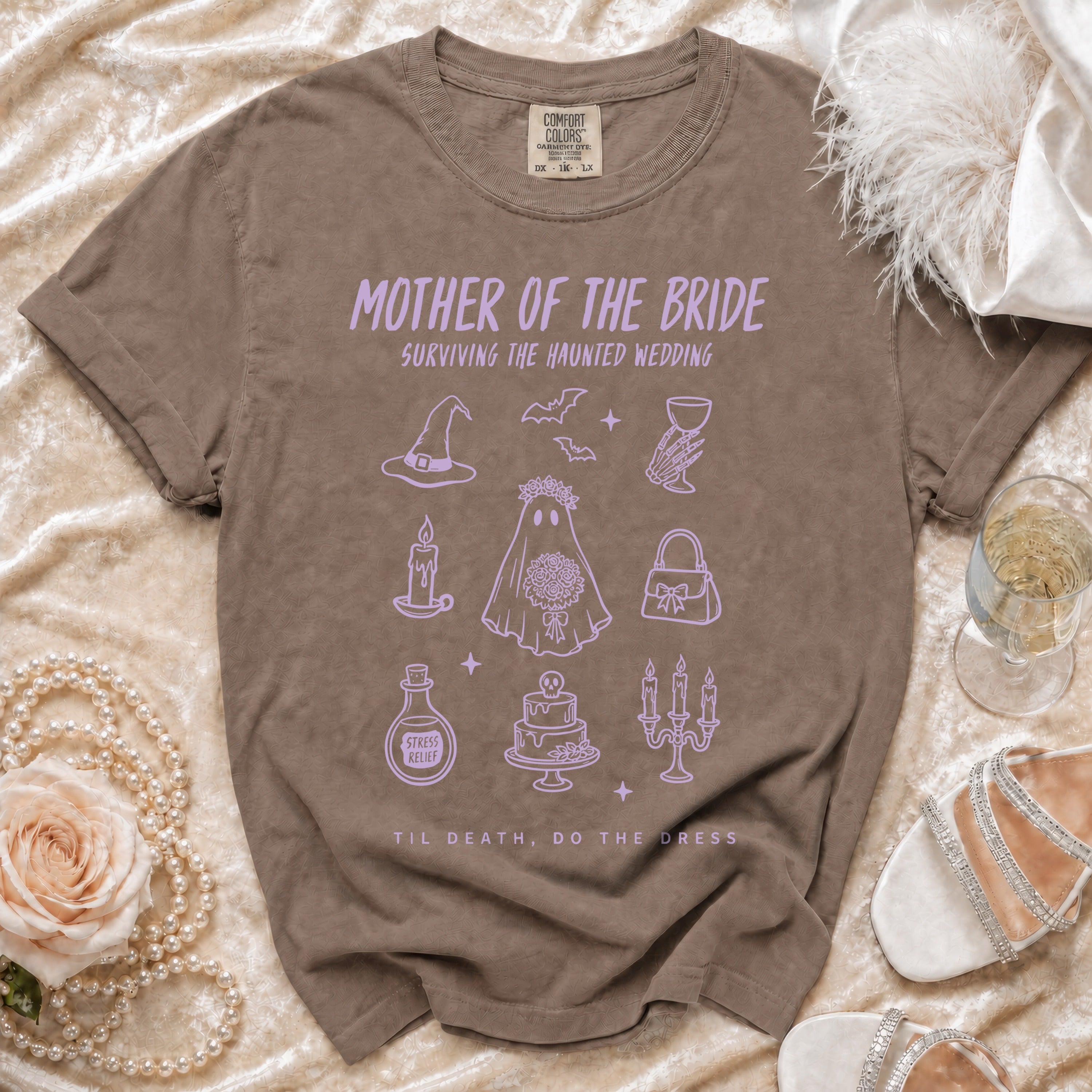 Brown Comfort Colors t-shirt with "Mother of the Bride" text and spooky wedding icons.