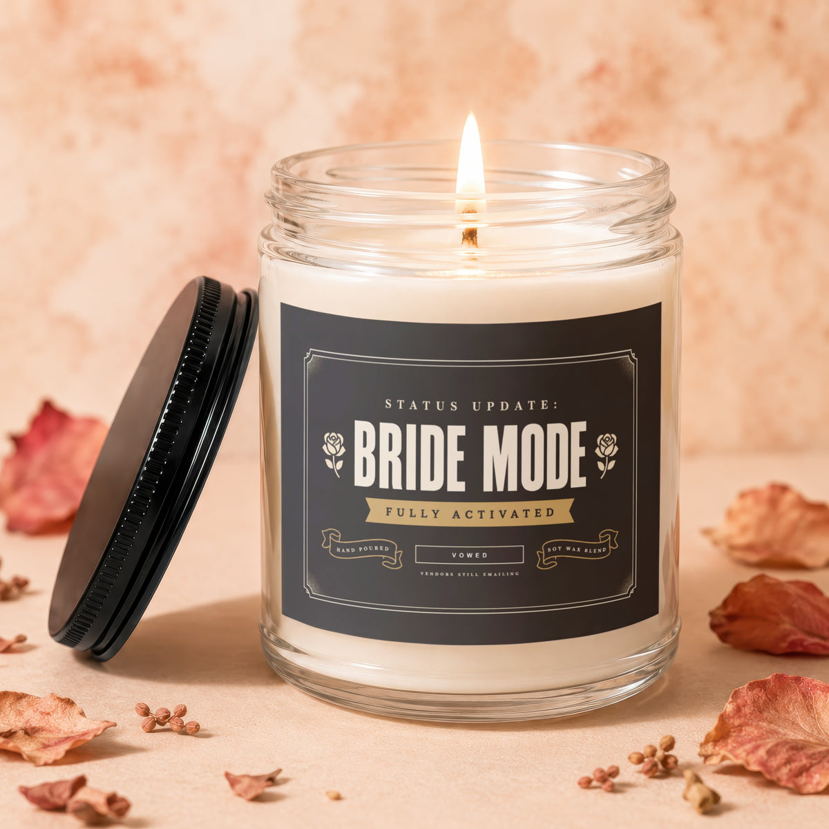 Lit candle in glass jar with "Bride Mode" label, "Fully Activated", and "Vowed".