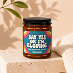 Amber jar candle with a retro-style label reading "Say Yes Or I'm Eloping! Maid of Honor, Please!".