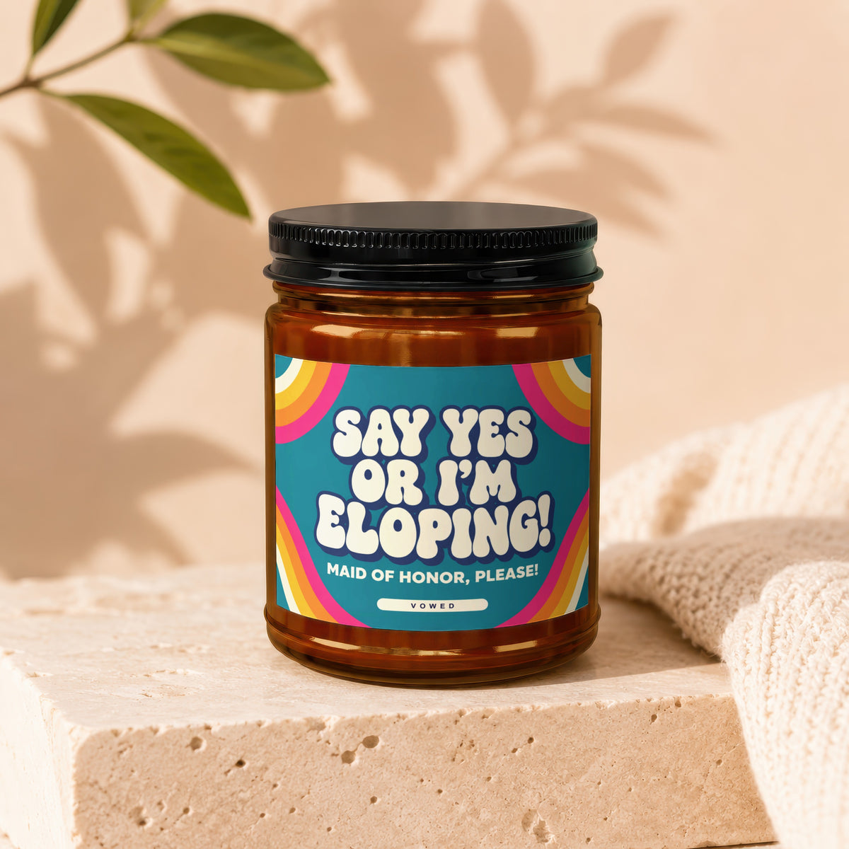 Amber jar candle with a retro-style label reading "Say Yes Or I'm Eloping! Maid of Honor, Please!".