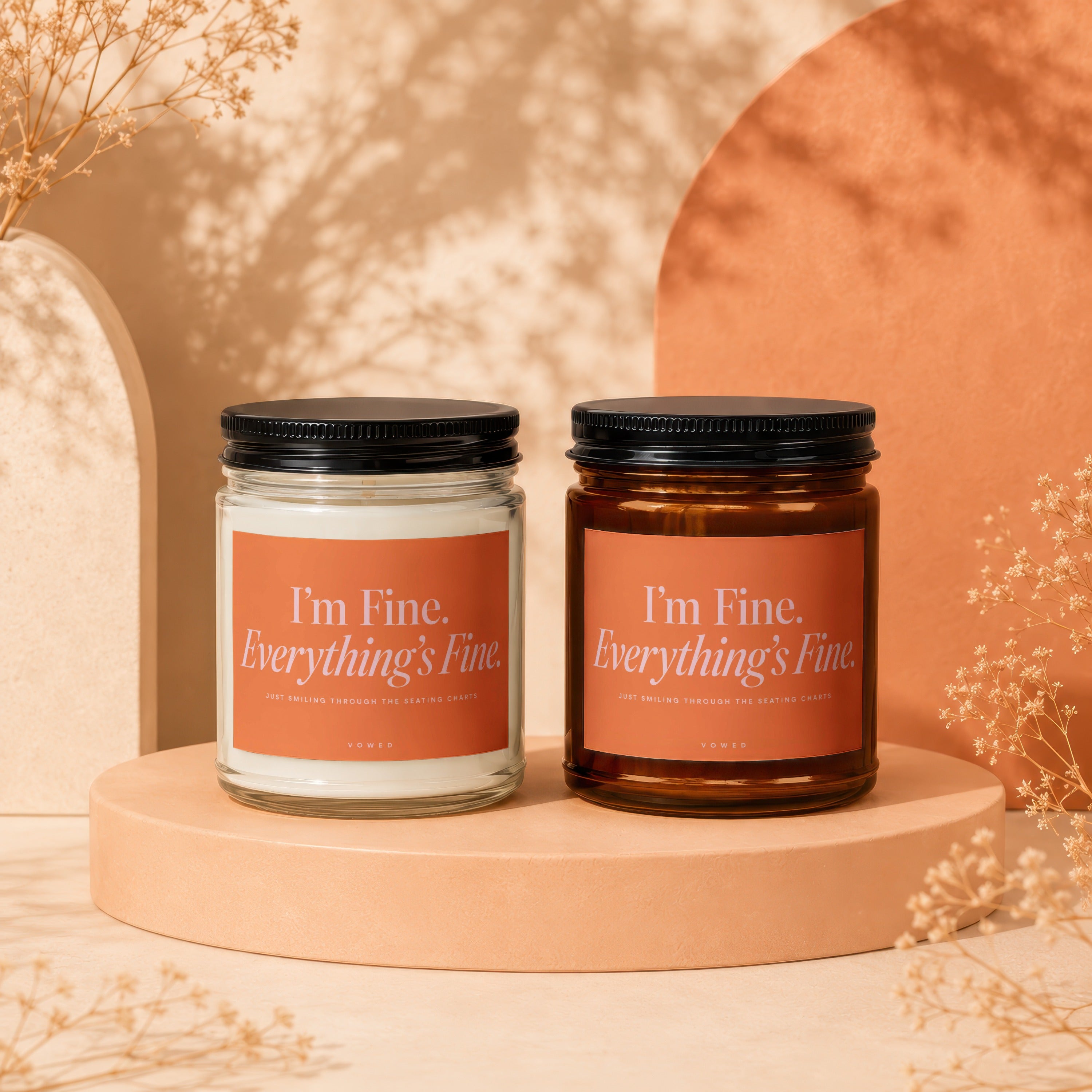 Two candles with orange labels reading "I'm Fine. Everything's Fine."