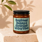 Amber jar candle with label reading "Boyfriend Hubby & Girlfriend Wifey Vibes".