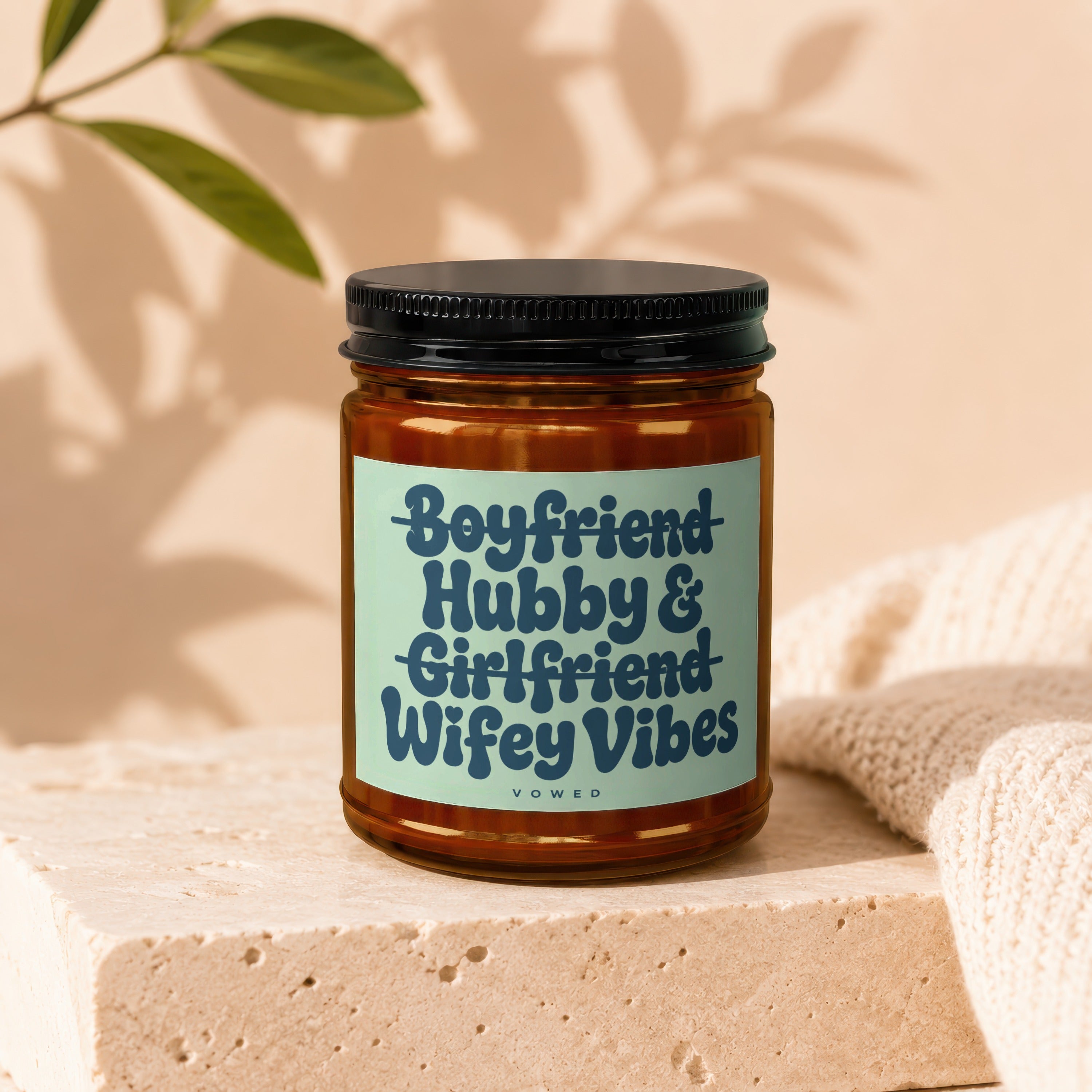 Amber jar candle with label reading "Boyfriend Hubby & Girlfriend Wifey Vibes".