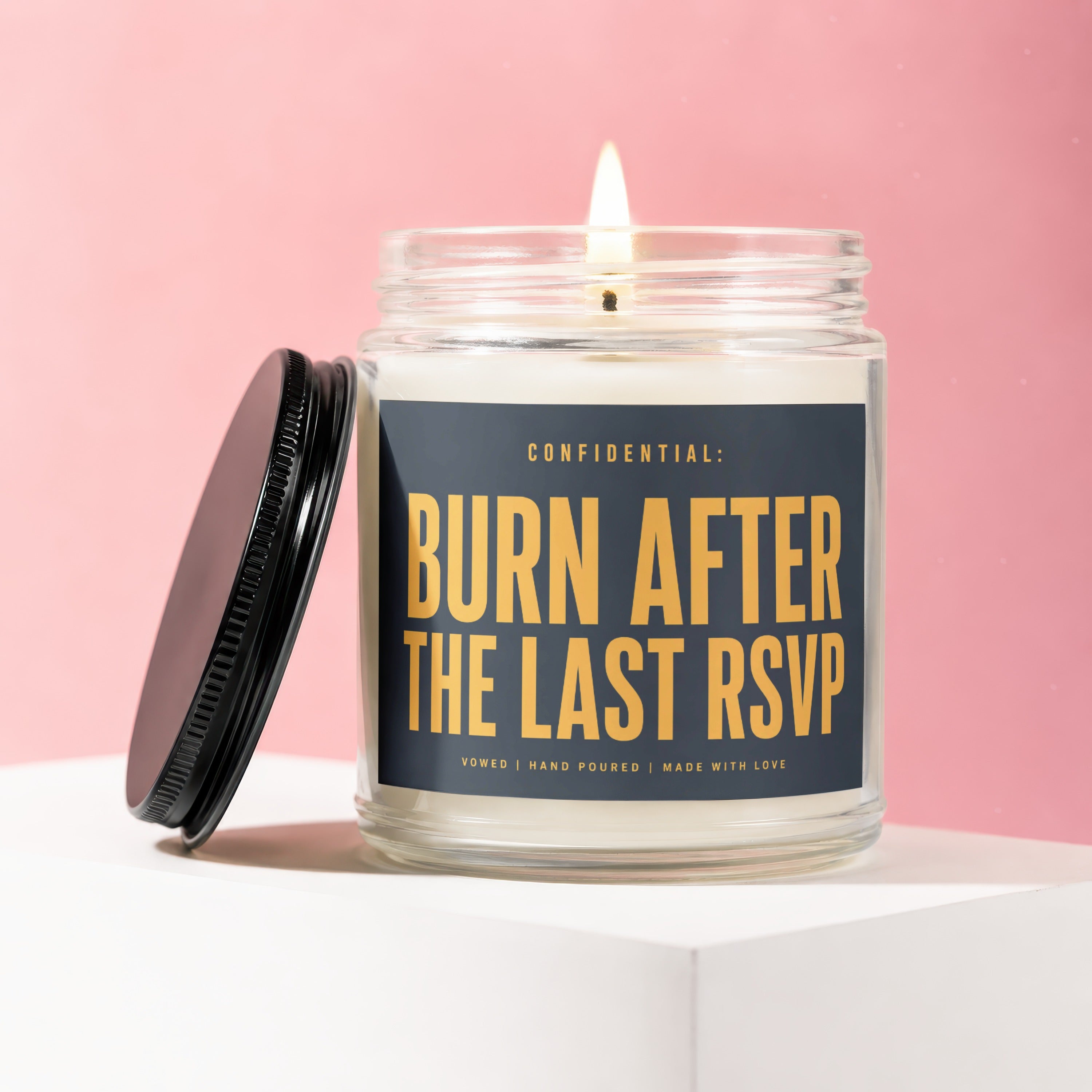 Candle with text "Confidential: Burn After The Last RSVP" on label.