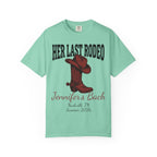 Mint green t-shirt with "Her Last Rodeo" text and cowboy boot graphic.