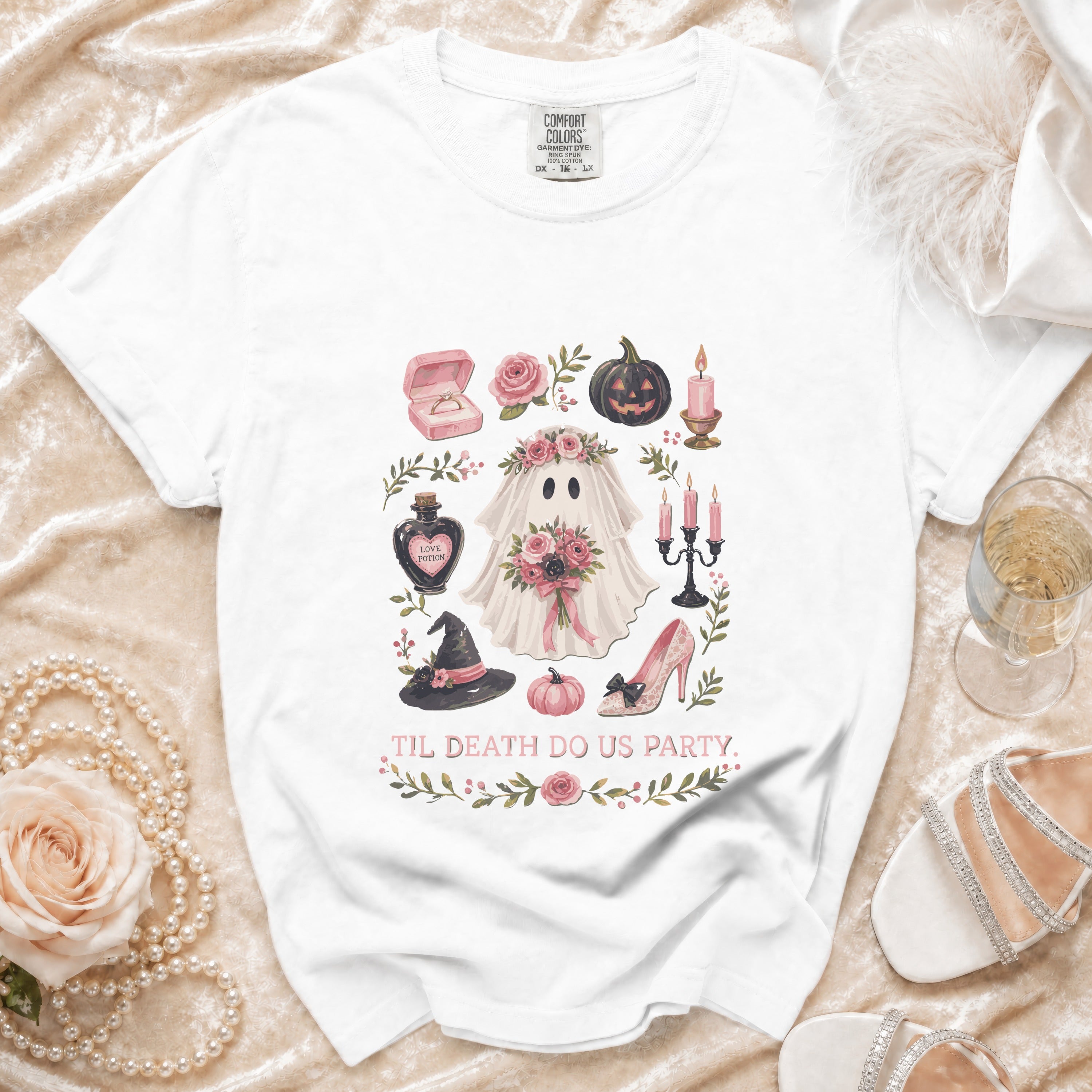 White t-shirt with Halloween-themed ghost graphic and "Til Death Do Us Party" text.