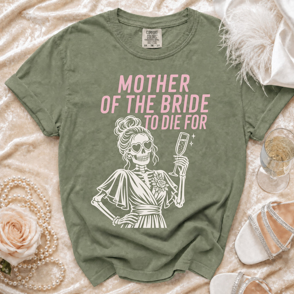 Green t-shirt with pink text "MOTHER OF THE BRIDE TO DIE FOR" and skeleton graphic.