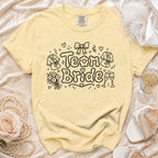 Yellow t-shirt with "Team Bride" text and wedding-themed graphics.