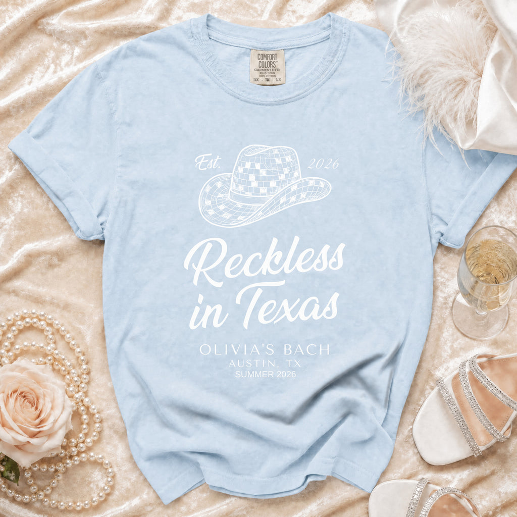 Light blue t-shirt with "Reckless in Texas" and bachelorette details.