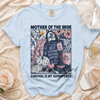 Light blue t-shirt with "Mother of the Bride" graphic and "Survival is My Superpower."