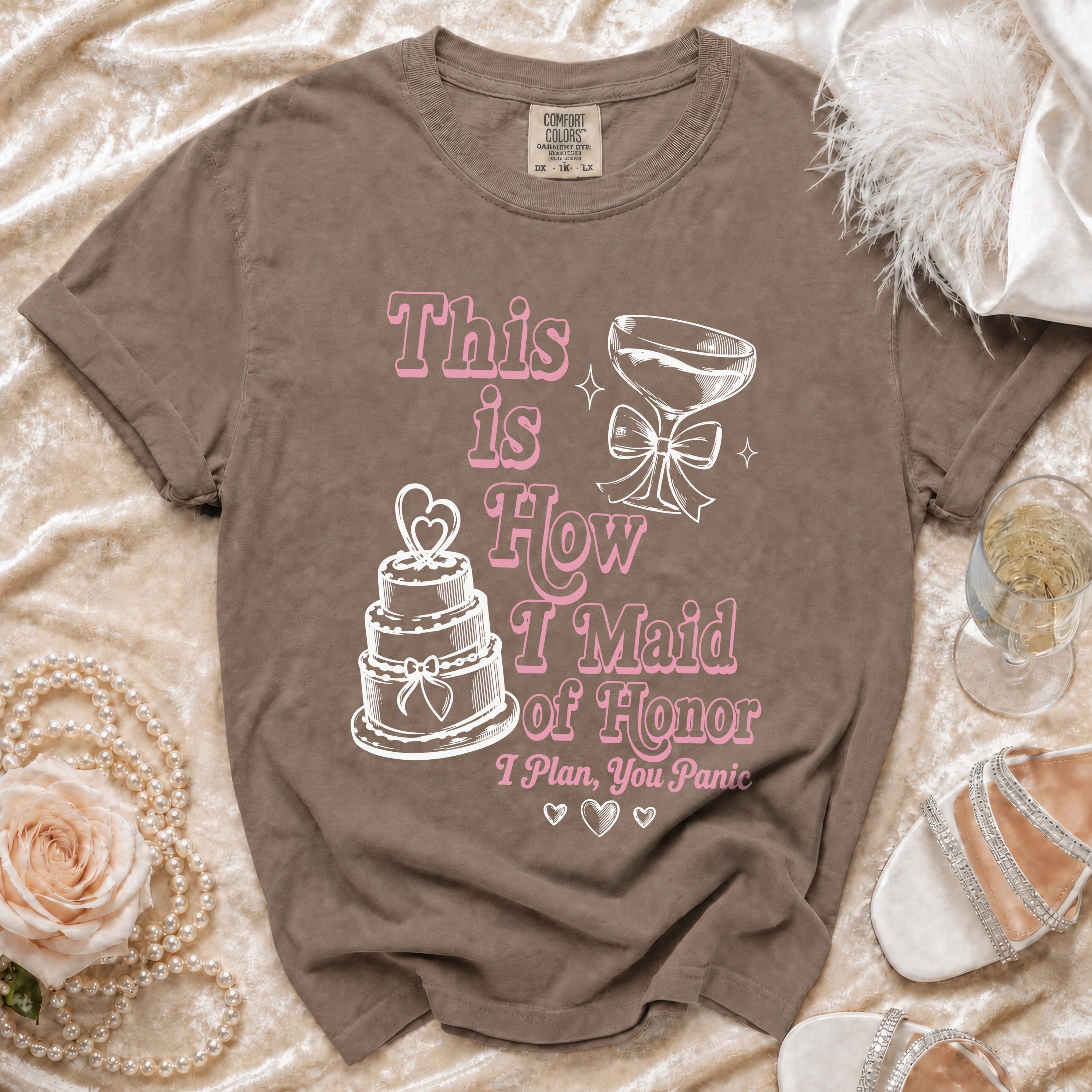 Brown t-shirt with pink text and graphics: "This is How I Maid of Honor I Plan, You Panic".