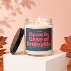Scented candle with "Open in Case of Bridezilla" warning label.