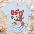 Light blue t-shirt with "Her Last Rodeo" and bachelorette details.
