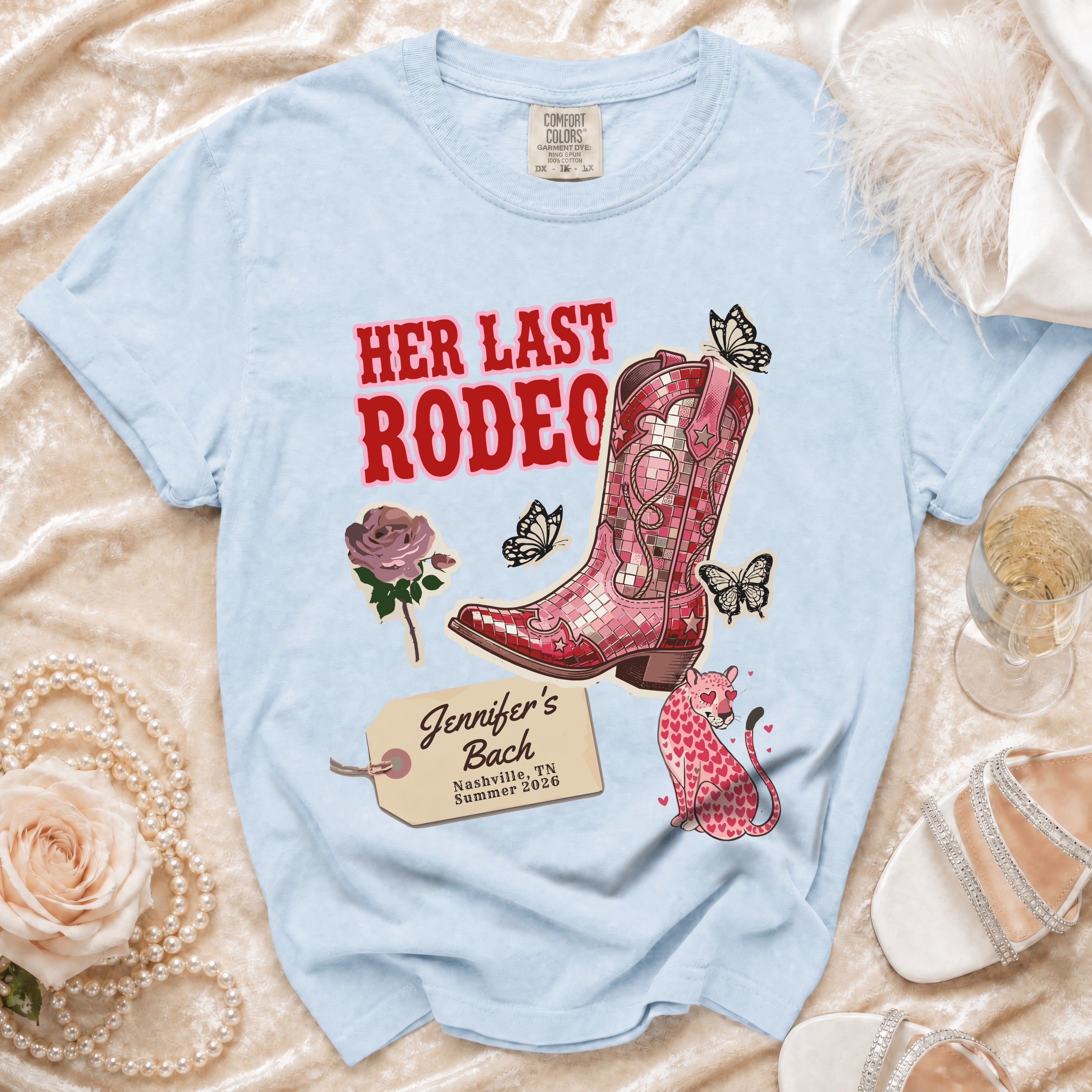 Light blue t-shirt with "Her Last Rodeo" and bachelorette details.
