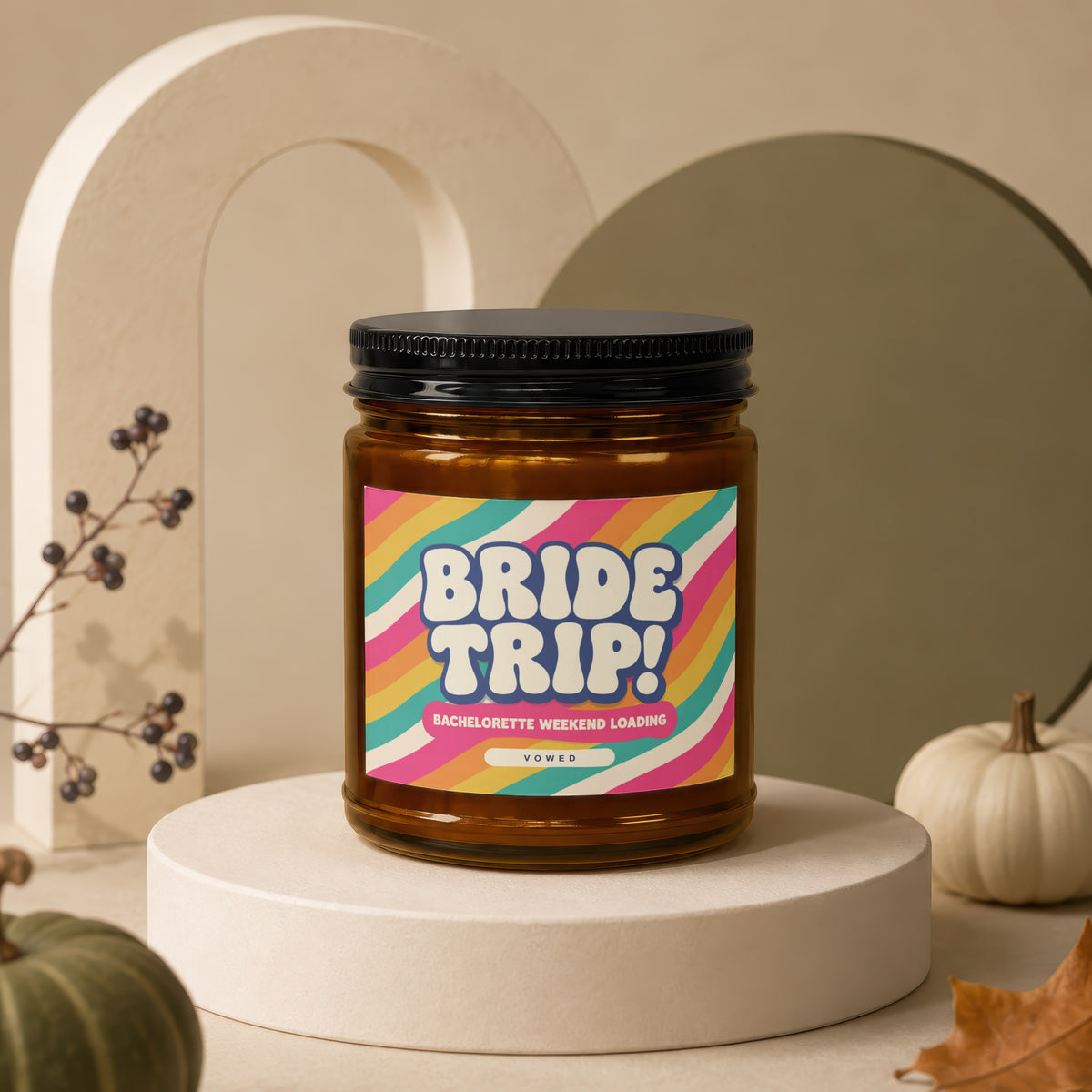 Amber jar candle with "BRIDE TRIP! BACHELORETTE WEEKEND LOADING VOWED" label.