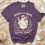 Purple t-shirt with ghost graphic: "Mother of the Groom" and "Raised the groom. Raising spirits."