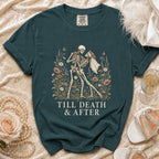 Teal t-shirt with skeleton couple dancing among flowers, reads "Till Death & After."