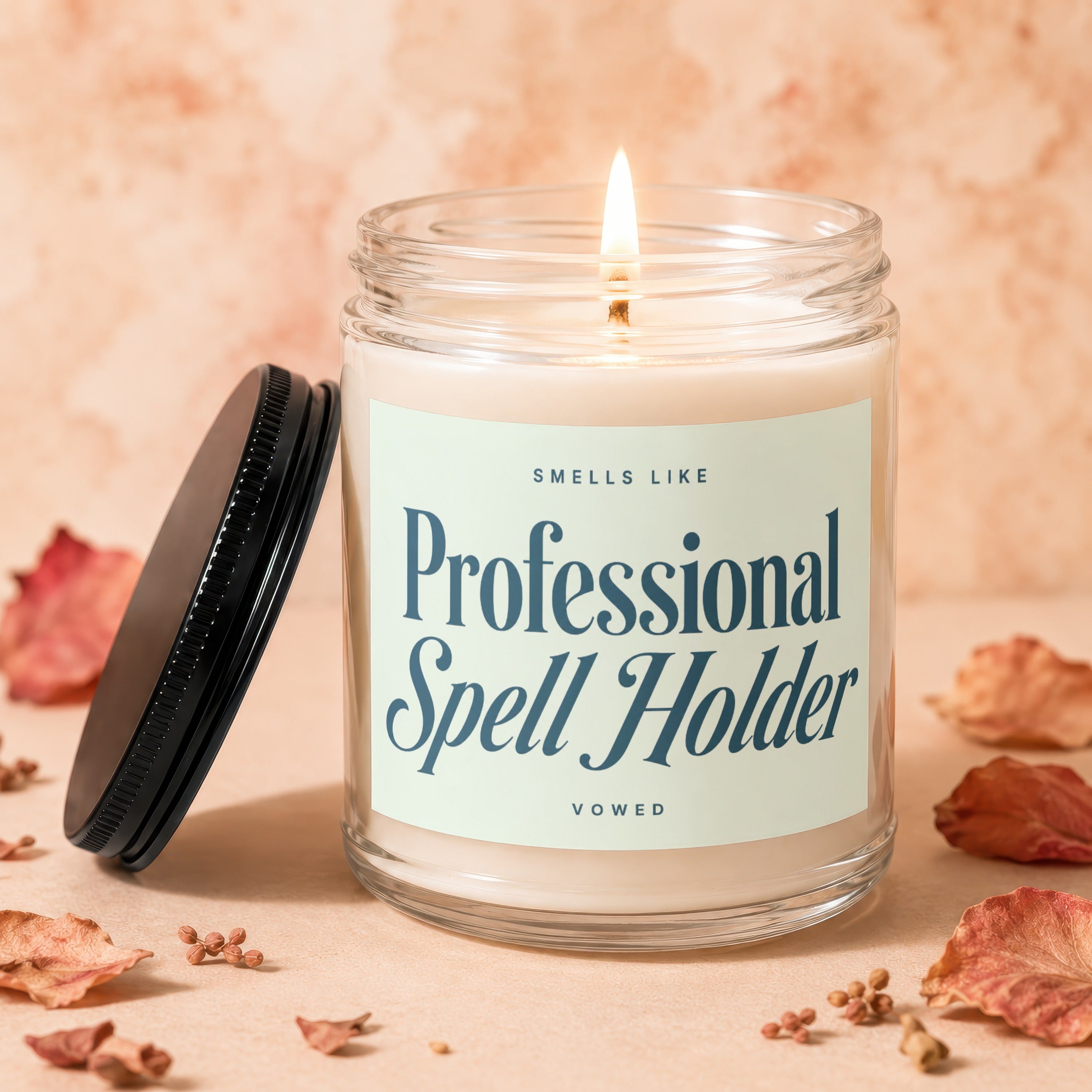 Burning soy candle in glass jar with lid, reads "Professional Spell Holder".