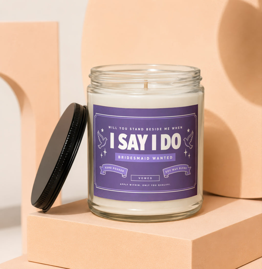 Candle with "I Say I Do Bridesmaid Wanted" label, hand-poured soy wax blend.