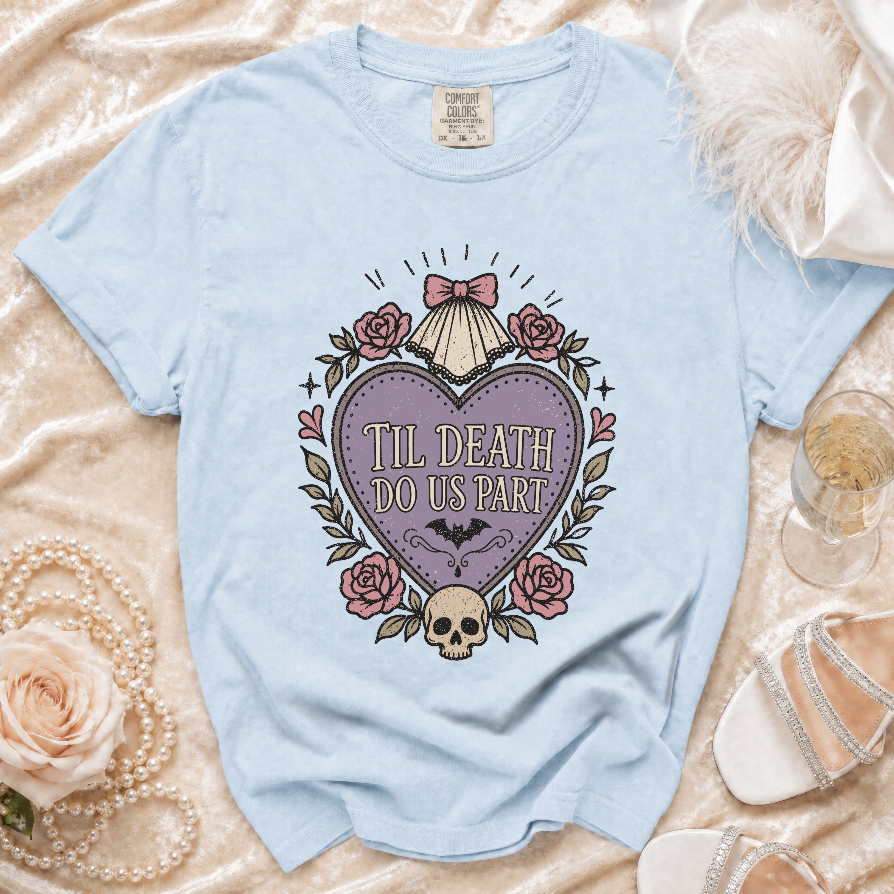 Light blue t-shirt with "Til Death Do Us Part" graphic featuring a skull, roses, and bat.