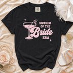 Black t-shirt with pink "Mother of the Bride Era" graphic and champagne glass.