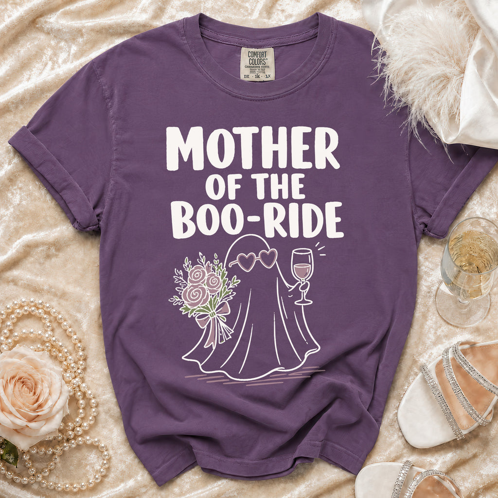 Purple t-shirt with "Mother of the Boo-Ride" text and ghost graphic holding flowers and wine.