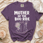 Purple t-shirt with "Mother of the Boo-Ride" text and ghost graphic holding flowers and wine.