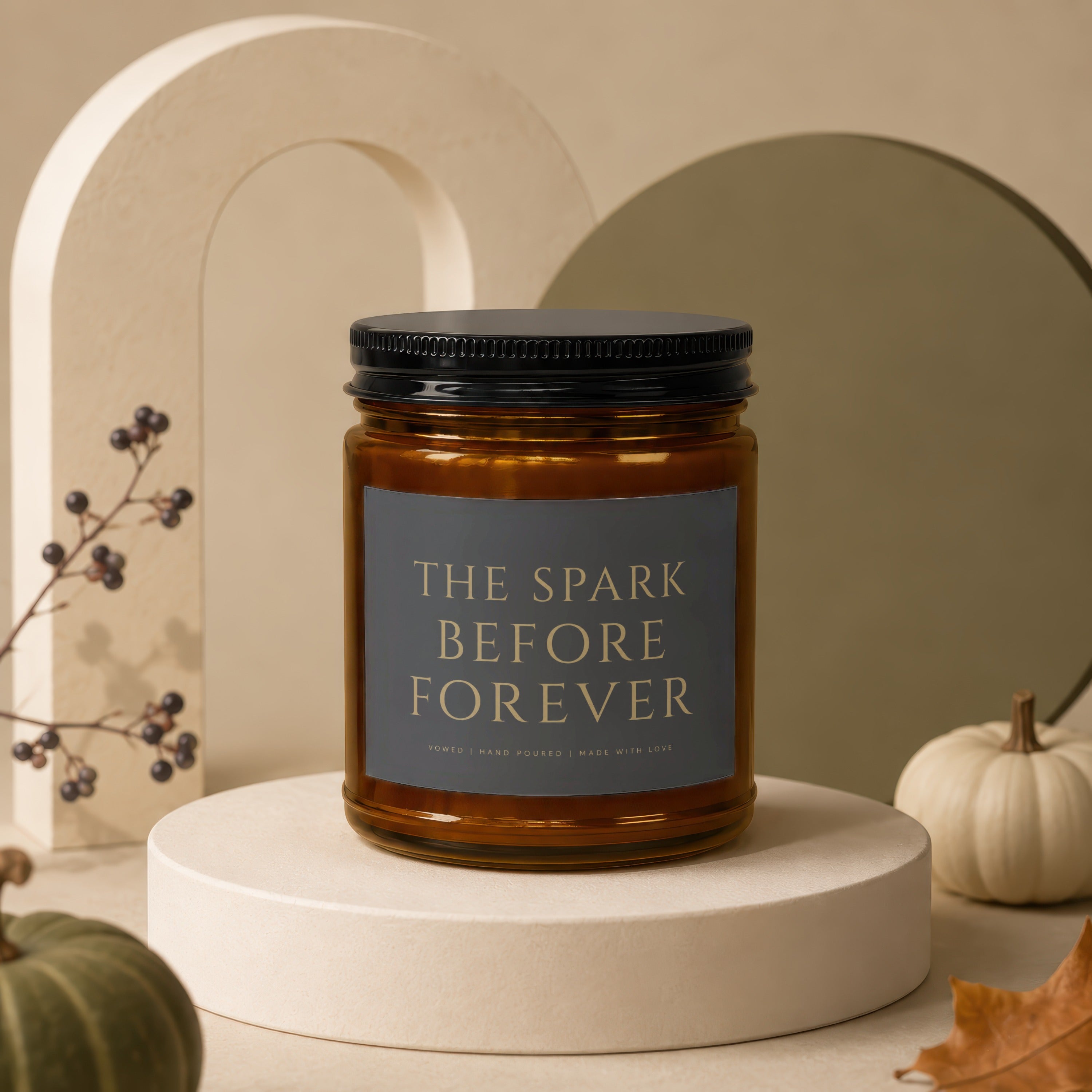 Amber candle in a jar with label "THE SPARK BEFORE FOREVER"