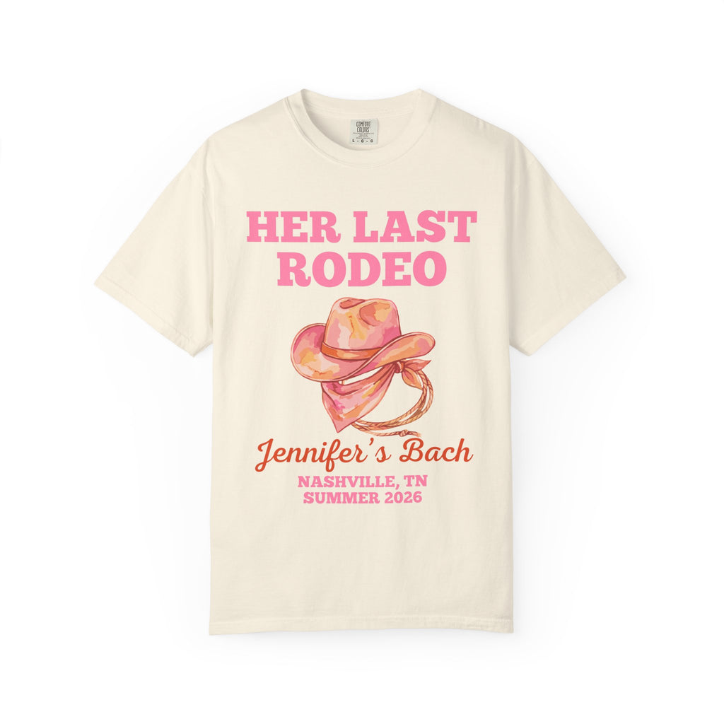 Cream t-shirt with "Her Last Rodeo Jennifer's Bach Nashville, TN Summer 2026" and a pink cowboy hat.
