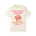 Cream t-shirt with "Her Last Rodeo Jennifer's Bach Nashville, TN Summer 2026" and a pink cowboy hat.