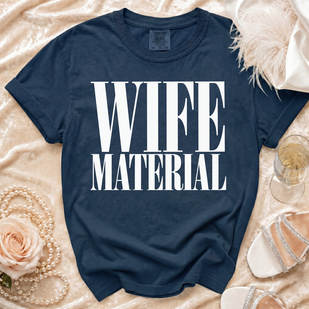 Navy t-shirt with white text "WIFE MATERIAL" and "COMFORT COLORS" label.