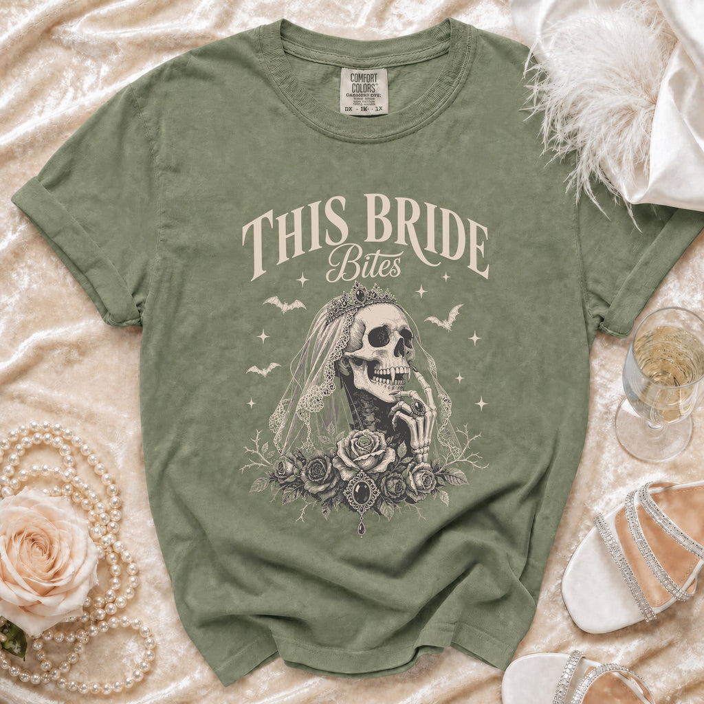 Olive green t-shirt with "This Bride Bites" skeleton bride graphic.