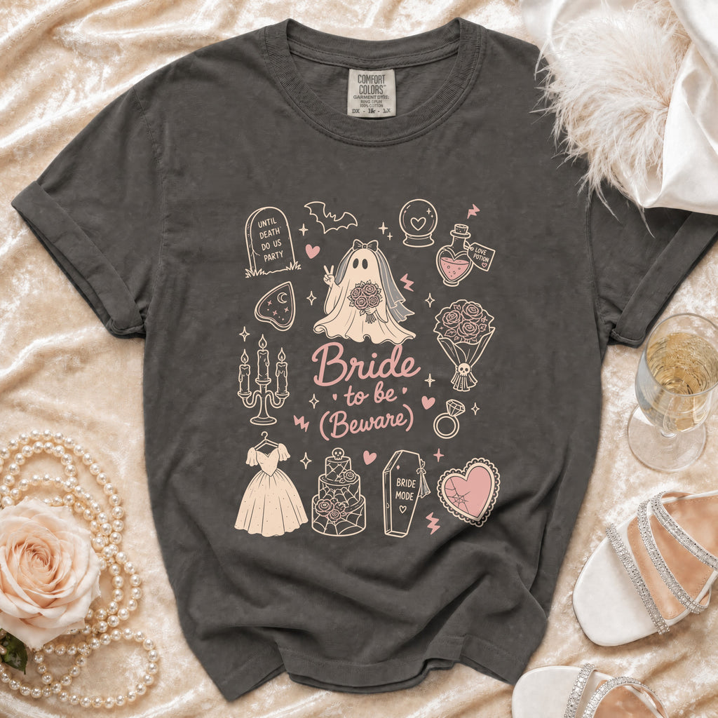 Dark grey t-shirt with bride-themed cartoon graphics and text "Bride to be (Beware)".