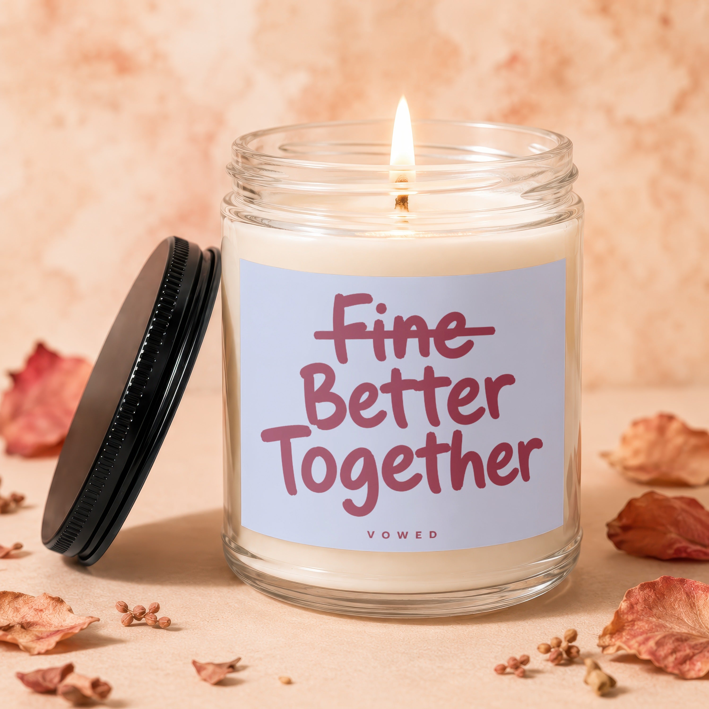 Lit jar candle with the text "Fine Better Together Vowed" on the label.
