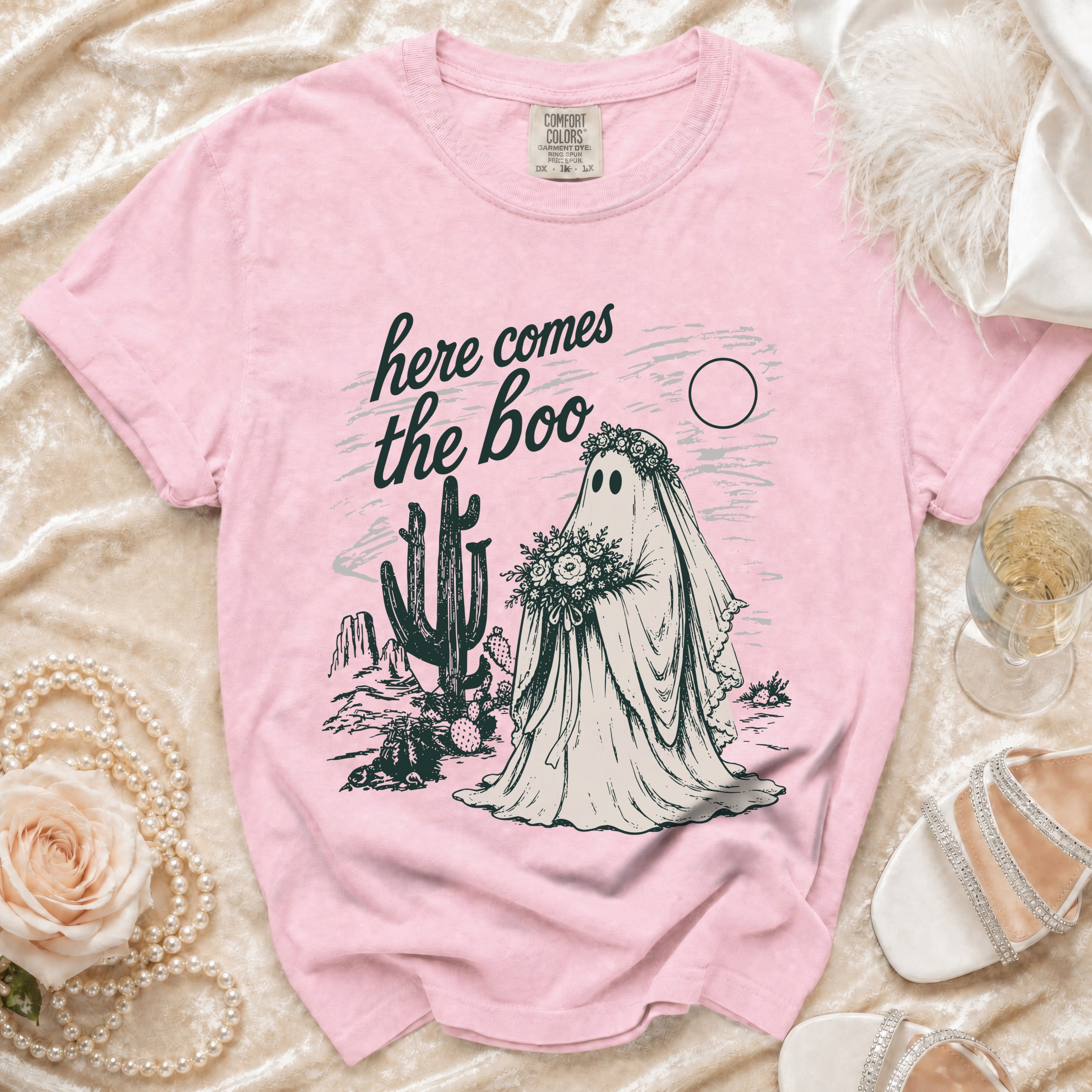 Pink t-shirt with ghost bride graphic and "here comes the boo" text.