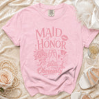 Pink t-shirt with "MAID OF HONOR Obviously" text and wedding themed graphics.