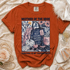 Orange t-shirt with "Mother of the Bride Survival is My Superpower" graphic.