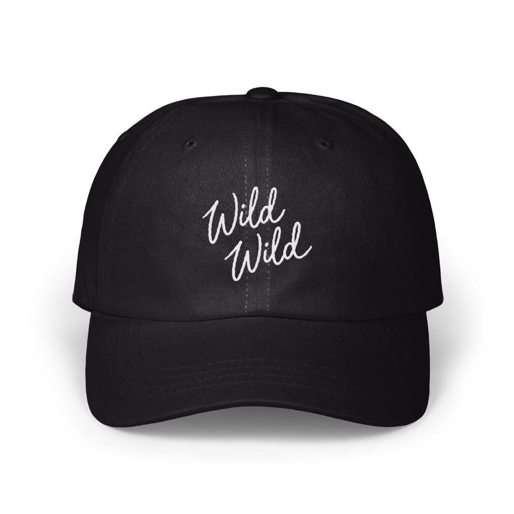 A black baseball cap features the white embroidered cursive text Wild Wild on the front.